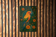 A colorful parrot is depicted on a green and black background, surrounded by flowers and leaves, mounted on a wooden wall.