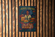 a colorful poster advertising an Injera Market, with a woman depicted in the center surrounded by stacks of bread.