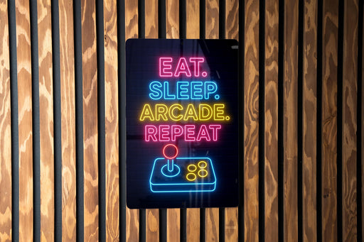 A neon sign with the text "EAT. SLEEP. arcADE. REPEAT" in neon colors is displayed on a wooden wall.
