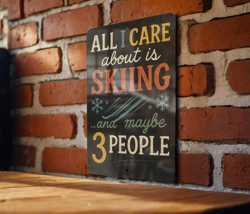 A sign with the text "ALL I CARE ABOUT IS SKIING...and maybe 3 PEOPLE" is displayed on a brick wall.