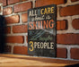 A sign with the text "ALL I CARE ABOUT IS SKIING...and maybe 3 PEOPLE" is displayed on a brick wall.