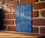 A blue sign with white text is mounted on a brick wall, providing instructions for activities such as eating, sleeping, puzzles, and repeating.