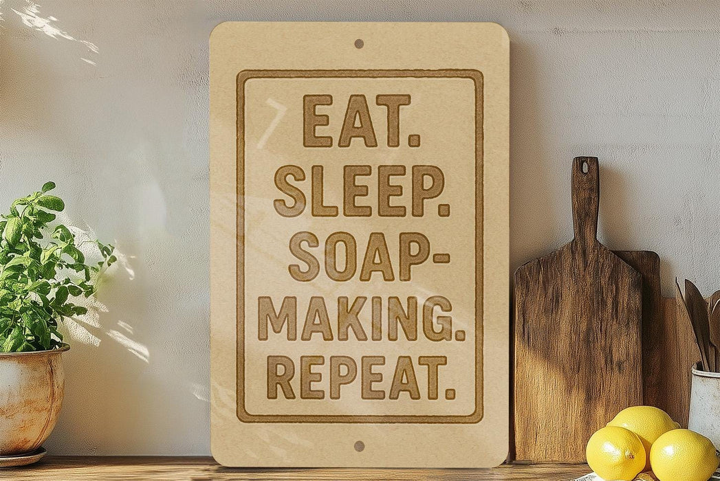 a wooden sign with the text "EAT. SLEEP. SOAP-MAKING. REPEAT." on it, placed on a wooden shelf next to a potted plant and kitchen utensils.