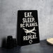 a sign with the text "EAT. SLEEP. RC PLANES. REPEAT." along with a graphic of a small airplane.
