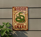 a sign with a green snake on it, mounted on a wall.