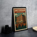 A framed poster of Amsterdam, Netherlands, featuring a colorful illustration of the city's iconic buildings and a bridge.