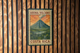 A vintage-style poster of an Arenal Volcano in Costa Rica, featuring a colorful illustration of the volcano and the surrounding landscape.