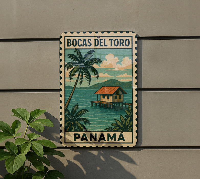 A vintage-style metal sign with a tropical island scene and palm trees, featuring the text "BOCAS DEL TORO PANAMA" and a postage stamp-like border.