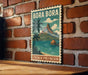 A vintage-style poster of Bora Bora, a tropical island in French Polynesia, is displayed on a brick wall.