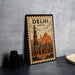 A vintage-style poster of the Taj Mahal, a famous monument in India, is displayed on a wall.
