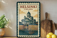 A framed poster of Helsinki, Finland, featuring a stylized illustration of the city's architecture and waterfront.