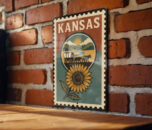 A vintage-style metal sign with the word "KANSAS" prominently displayed, featuring a sunflower and wagon in the center.