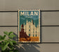 A vintage-style poster of the Milan Cathedral, a famous landmark in Italy, is displayed on a wall.