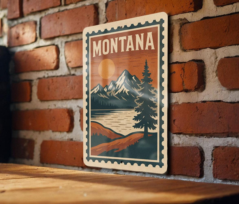 A vintage-style metal sign with the word "MONTANA" prominently displayed, featuring a mountain landscape with a pine tree and a lake.