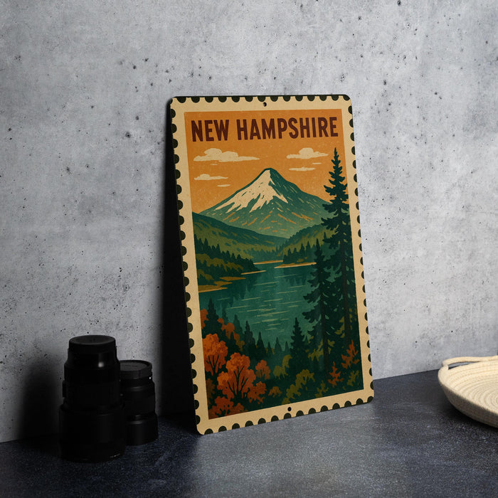 A metal sign with a mountain landscape and a lake, featuring the text "NEW HAMPSHIRE" in the center.