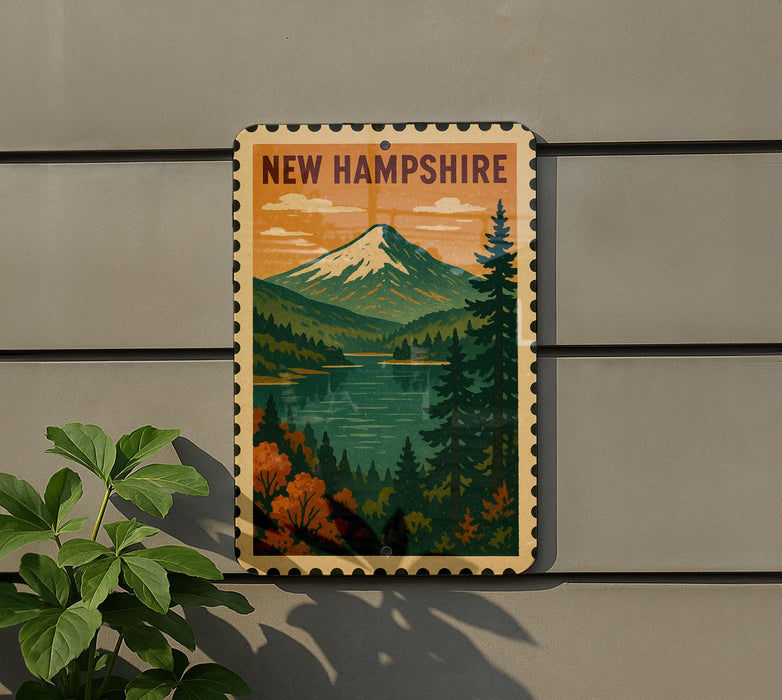 A vintage-style metal sign with the text "NEW HAMPSHIRE" and an illustration of a mountain landscape with a lake and pine trees.