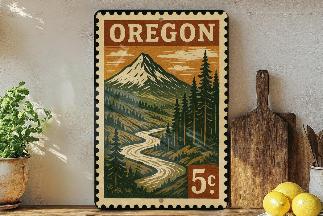 A vintage-style metal sign with a mountain landscape and a river, featuring the word "OREGON" prominently displayed.