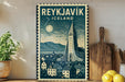 A vintage-style metal sign with a stylized illustration of Reykjavik, Iceland, featuring a church spire and a cityscape, is displayed on a shelf next to a wooden cutting board and a potted plant.