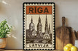 A framed poster of the Riga Cathedral in Latvia, featuring a detailed illustration of the cathedral's architecture.