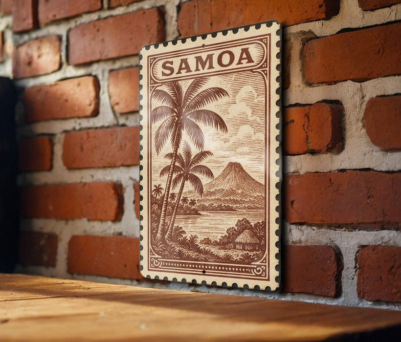 A framed stamp depicting a tropical island landscape with palm trees and a mountain in the background, mounted on a brick wall.