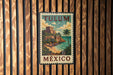 A vintage-style metal sign with the text "TULUM MEXICO" is displayed on a wooden wall.