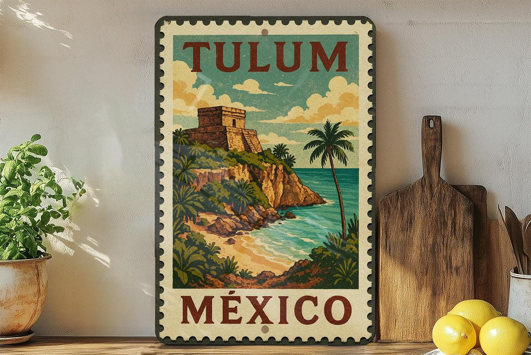 A vintage-style metal sign with the text "TULUM MEXICO" and an illustration of a tropical island with a castle, palm trees, and a beach.