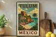 A vintage-style metal sign with the text "TULUM MEXICO" and an illustration of a tropical island with a castle, palm trees, and a beach.