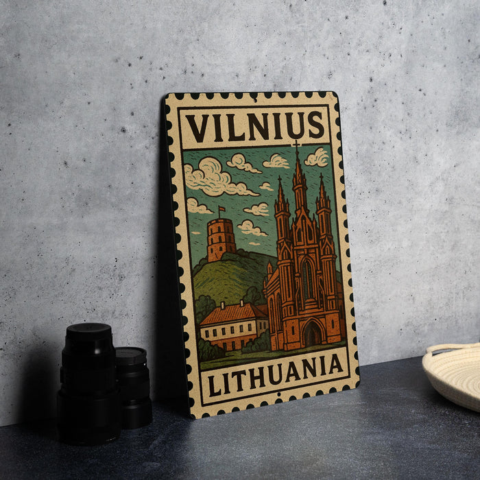 A metal stamp depicting a castle and hill in Vilnius, Lithuania, with the text "Vilnius" and "Lithuania" printed on it.