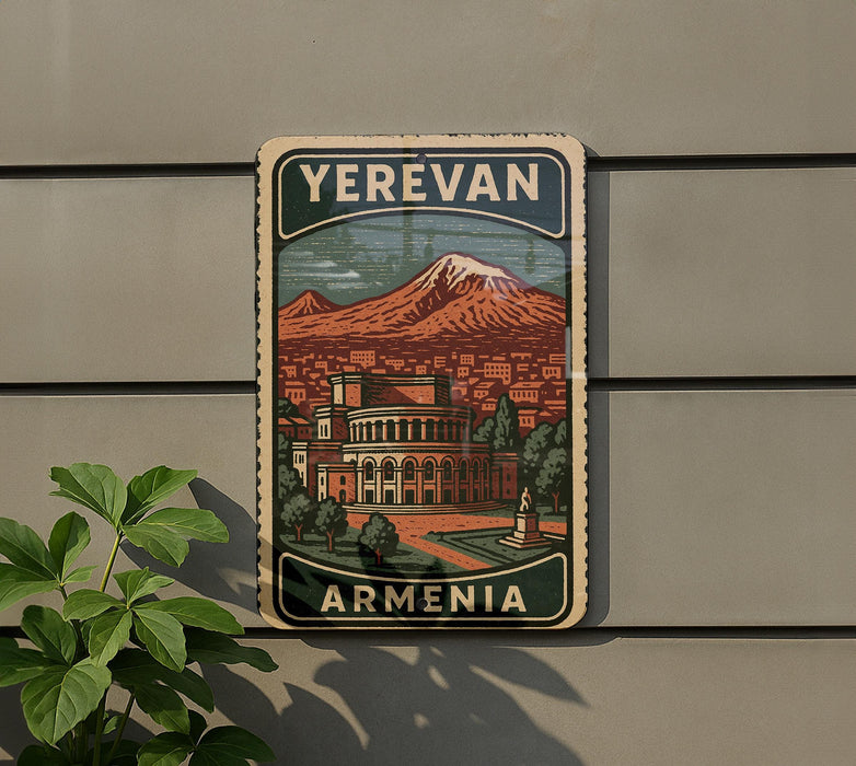 A vintage-style sign displaying the name "Yerevan Armenia" with an illustration of a city and a mountain in the background.