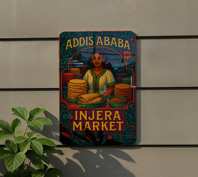 a colorful sign for an Injera Market, with a woman selling food and stacks of tortillas.