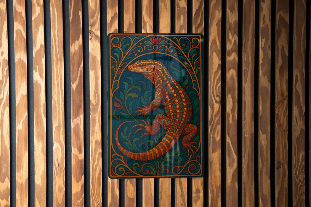 a colorful, ornate metal piece with a detailed illustration of a lizard or salamander on a wooden background.