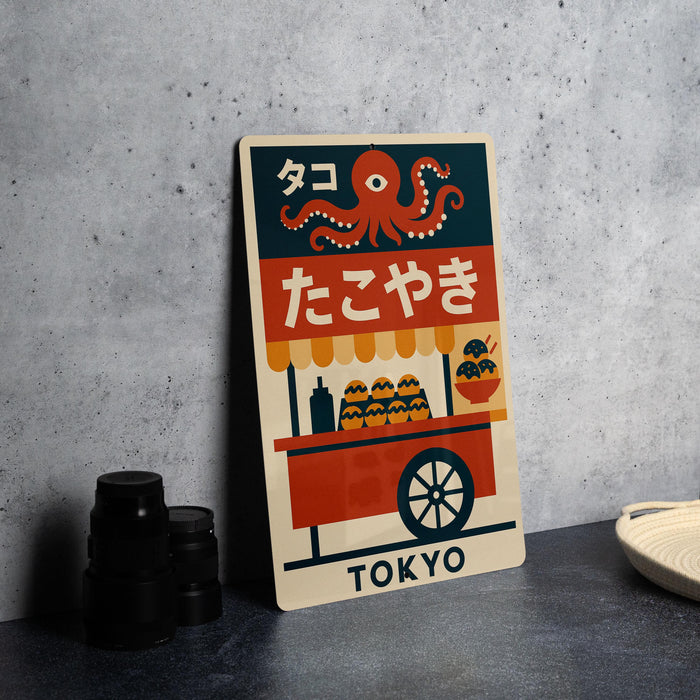 A colorful poster featuring an illustration of an orange octopus and various food items, along with the text "TOKYO" in the bottom right corner.