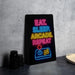 A neon sign with the text "EAT. SLEEP. ARCAKE. REPEAT" in neon colors is displayed on a black surface, with a video game controller visible below it.