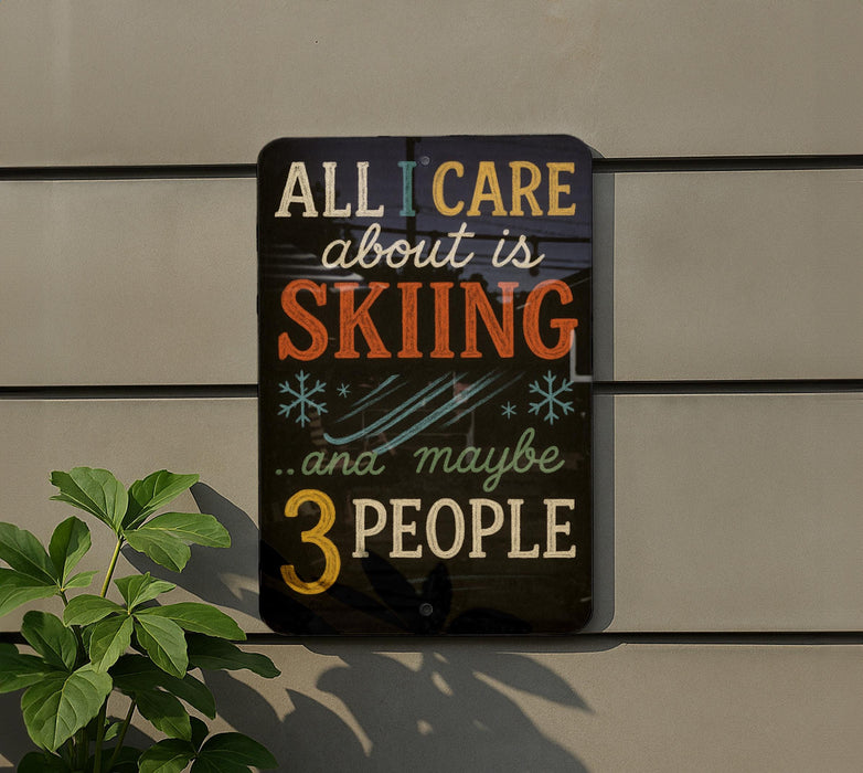 a sign with the text "All I care about is skiing...and maybe 3 people" displayed on a wall.