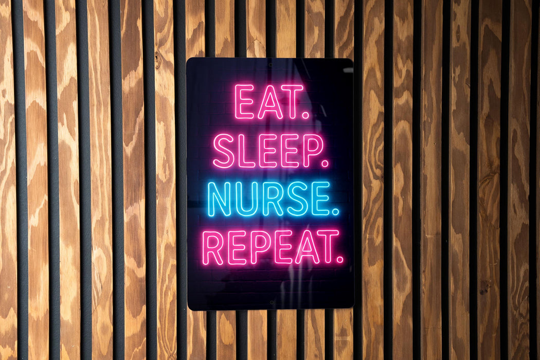 a sign with the text "EAT. SLEEP. NURSE. REPEAT." in neon colors, mounted on a wooden wall.