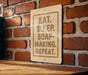 a wooden sign with the text "EAT. SLEEP. SOAP-MAKING. REPEAT."