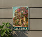 A vintage metal sign with a colorful illustration of a building with balconies and flowers, mounted on a wall.
