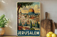 A vintage-style poster of Jerusalem, featuring the iconic Dome of the Rock, is displayed on a wall next to a wooden cutting board and some potted plants.