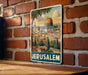 A vintage-style poster of Jerusalem, featuring the iconic Dome of the Rock, is displayed on a brick wall.