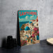 A vintage-style metal sign with the word "SANTORINI" prominently displayed, depicting a picturesque coastal town with colorful buildings, blue domes, and a clear blue sky.