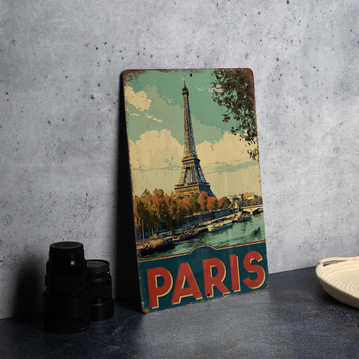 A vintage-style metal sign featuring the Eiffel Tower in Paris, with the word "PARIS" prominently displayed.