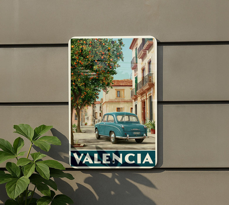 A vintage-style poster of a street scene in ValENCIA, Spain, featuring a blue car and a tree with orange leaves.