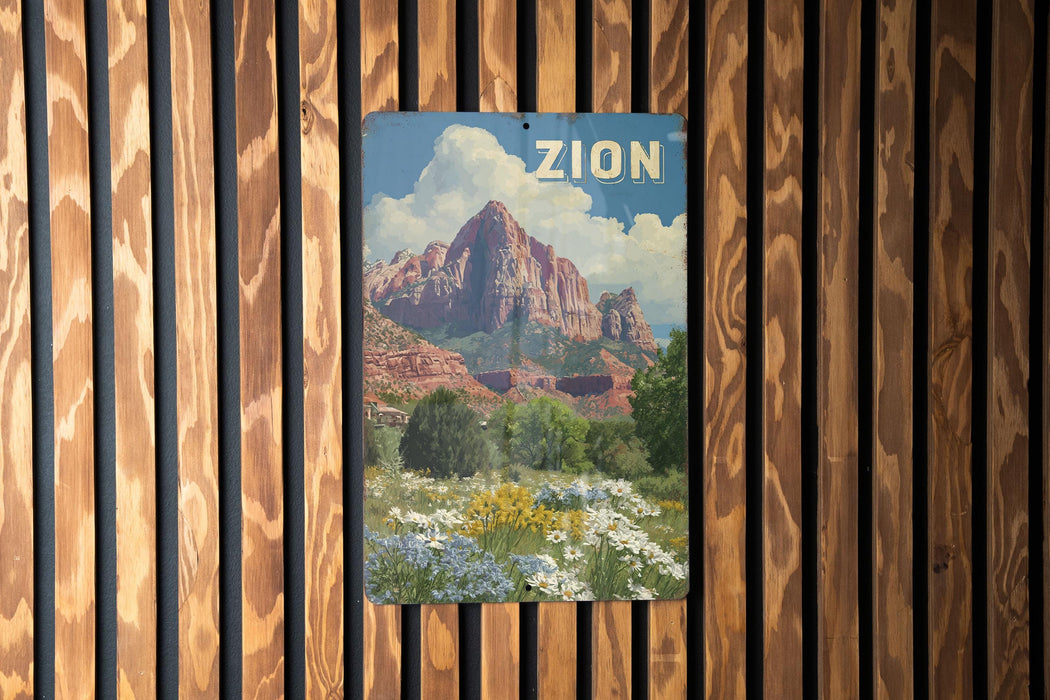 A vintage-style poster of a mountainous landscape with a large red rock formation and a blue sky with clouds, hanging on a wooden wall.