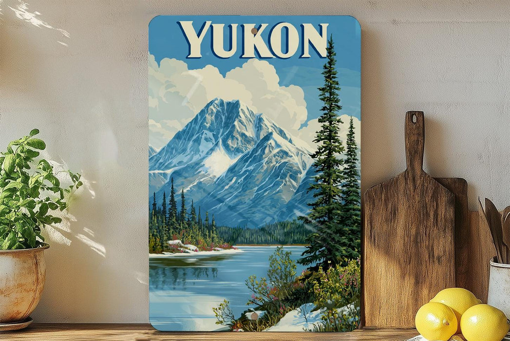 A framed vintage-style poster of a mountain landscape with a lake, pine trees, and a cloudy sky, displayed on a wall next to a wooden cutting board and some potted plants.