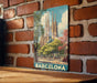 A vintage-style metal sign depicting the Sagrada Familia, a famous Roman Catholic church in Barcelona, Spain.