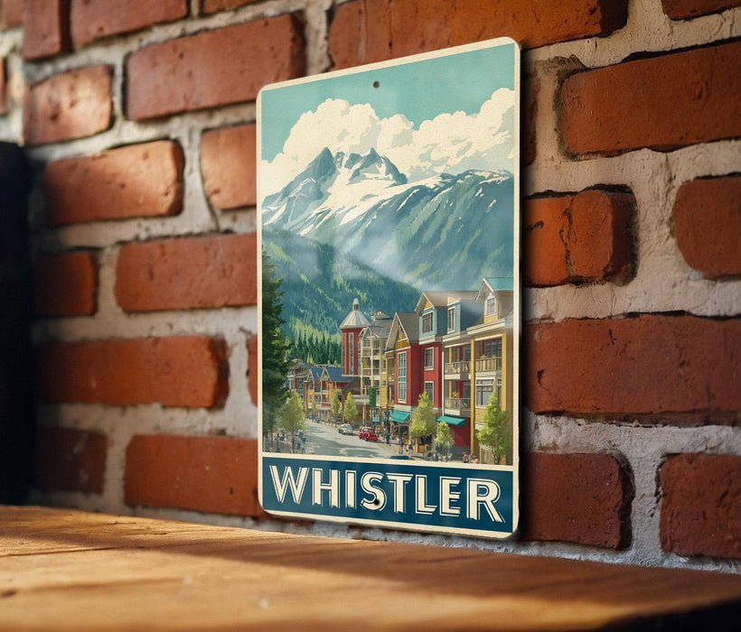 A vintage-style metal sign depicting a mountain town with colorful buildings and a clear blue sky.