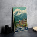A vintage-style metal sign depicting a mountain town in Whistler, British Columbia, Canada.