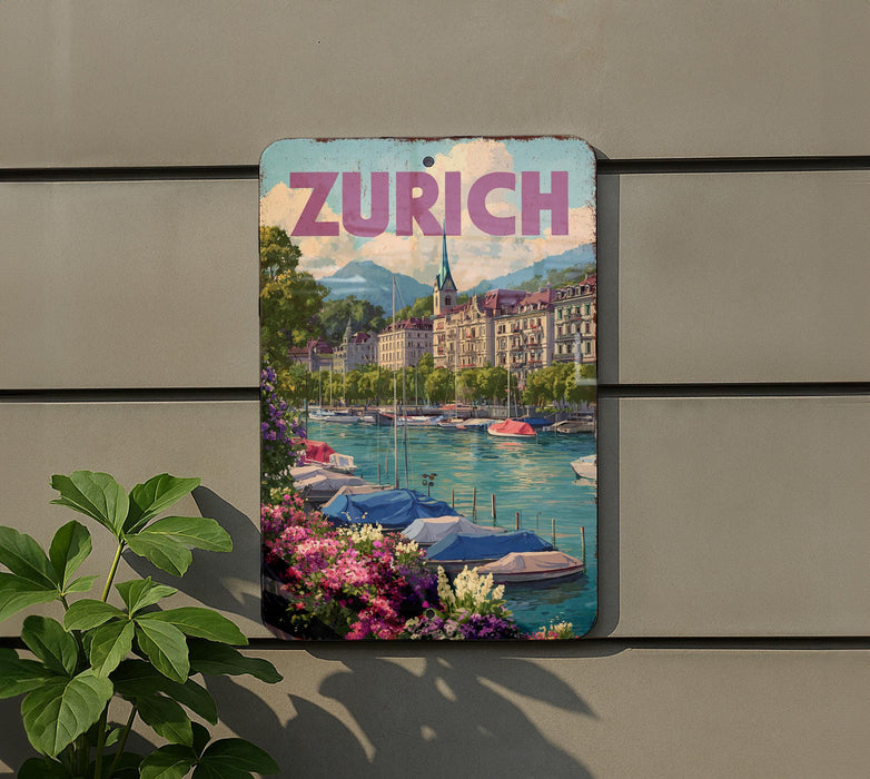 A vintage-style sign with the word "ZURICH" prominently displayed, featuring a scenic image of a canal with boats and colorful flowers.