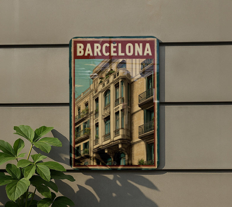 A poster of a building with balconies and a sign that says "Barcelona" is displayed on a wall.