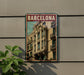 A poster of a building with balconies and a sign that says "Barcelona" is displayed on a wall.